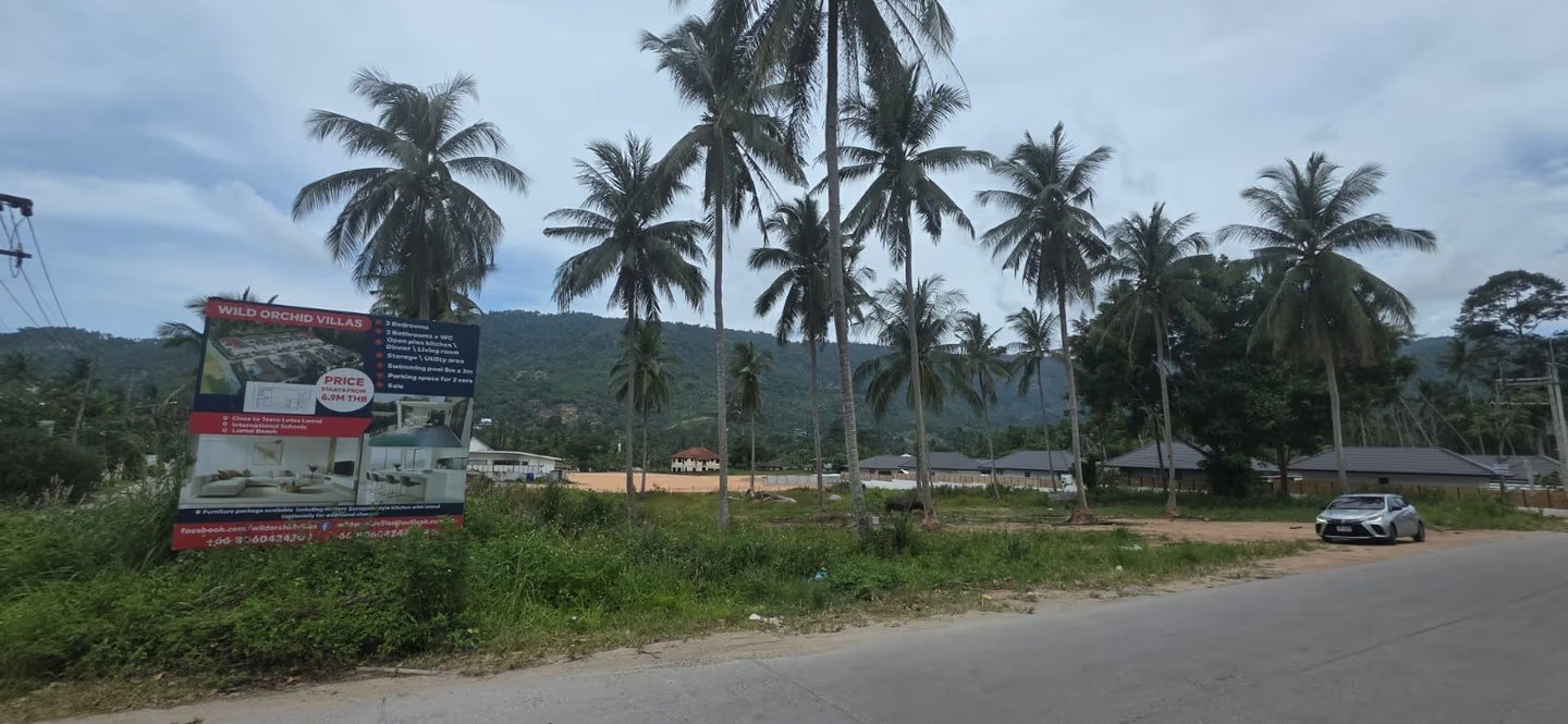 Wild Orchid Villas — the project's on-site marketing signboard